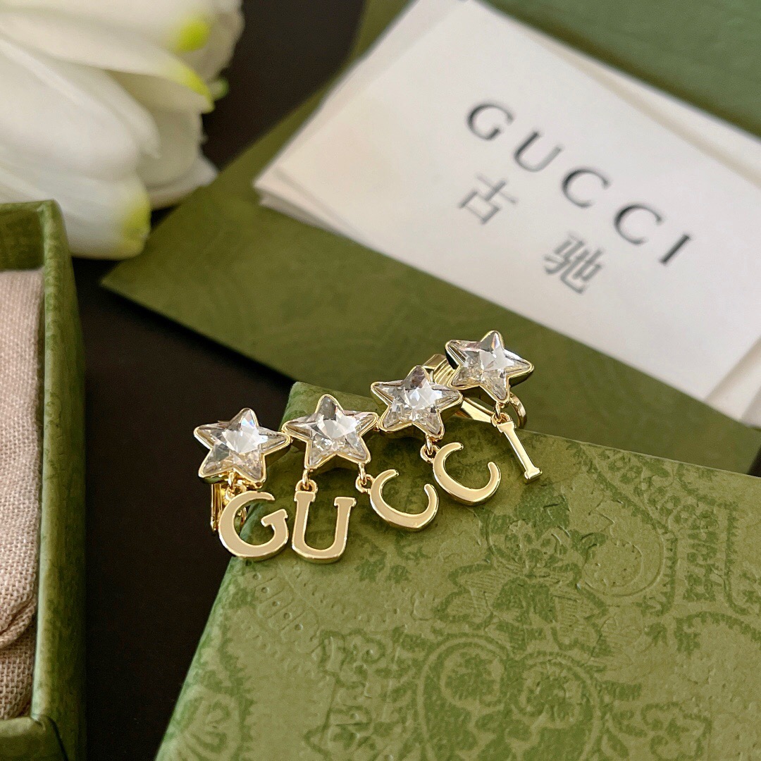 G*u*i earring