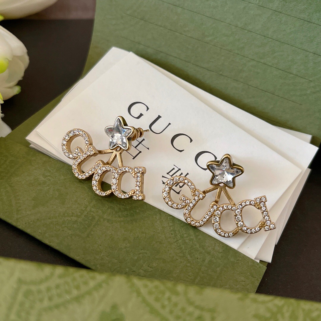 G*u*i earring