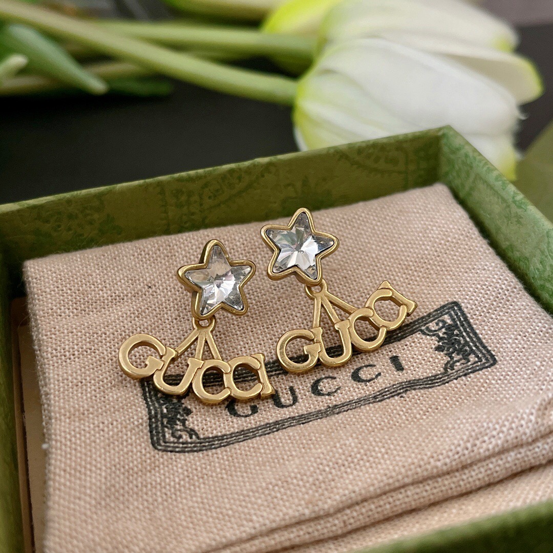 G*u*i earring