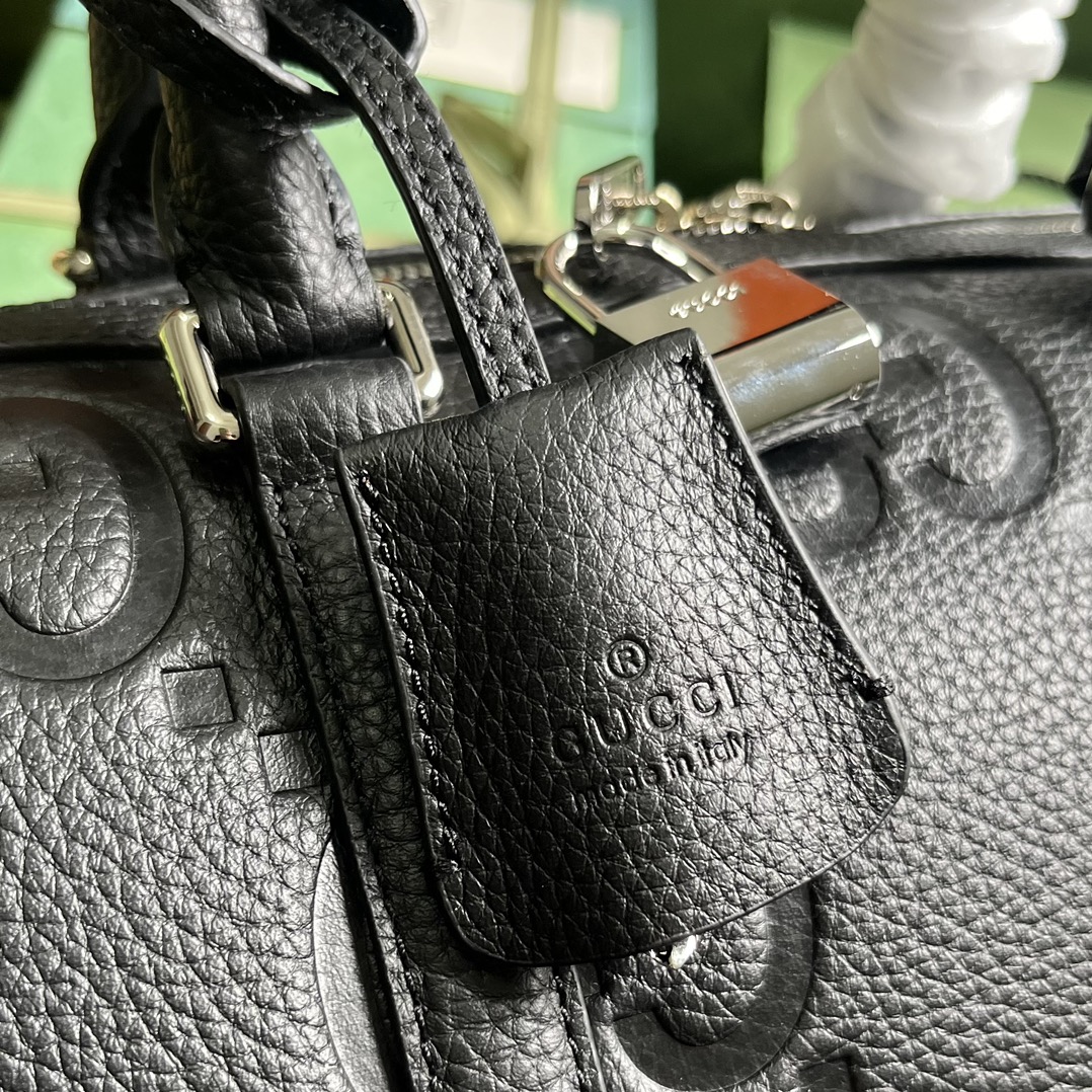 G*u*i gg duffle bag
