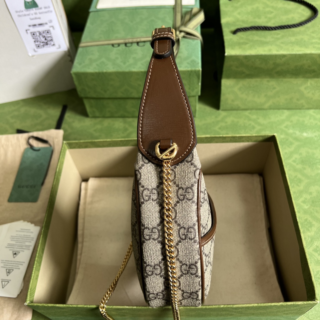 G*u*i half-moon-shaped mini bag with interlocking g