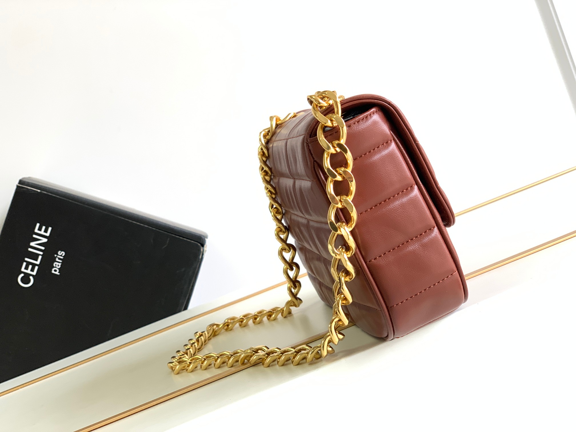 Ce**e chain shoulder bag matelasse monochrome