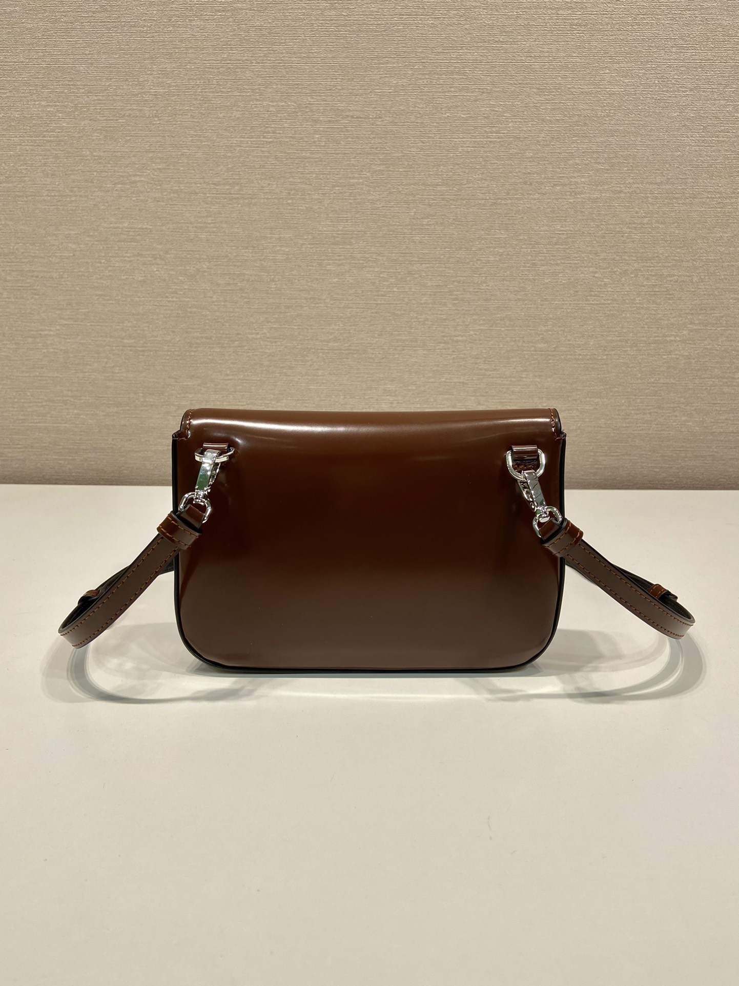 Pra*a brushed leather mini-bag with shoulder strap