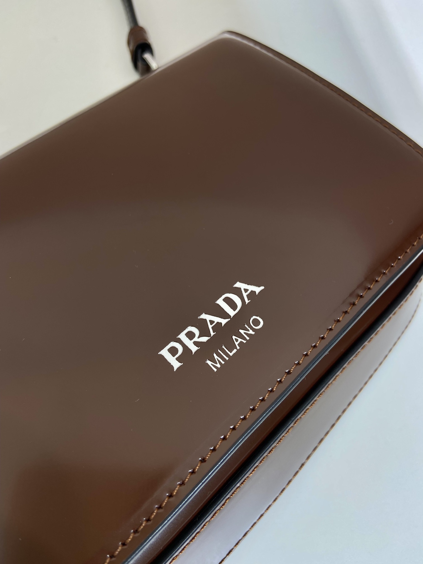 Pra*a brushed leather mini-bag with shoulder strap