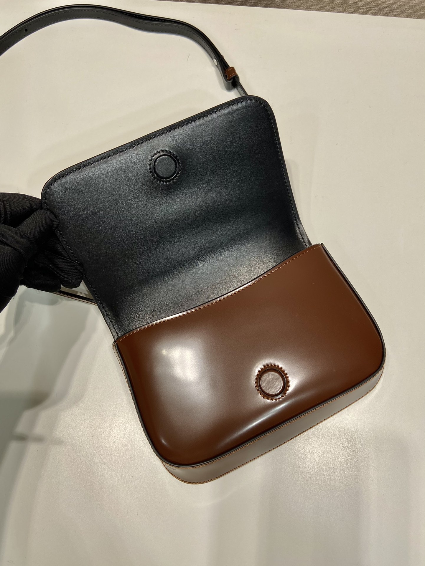 Pra*a brushed leather mini-bag with shoulder strap