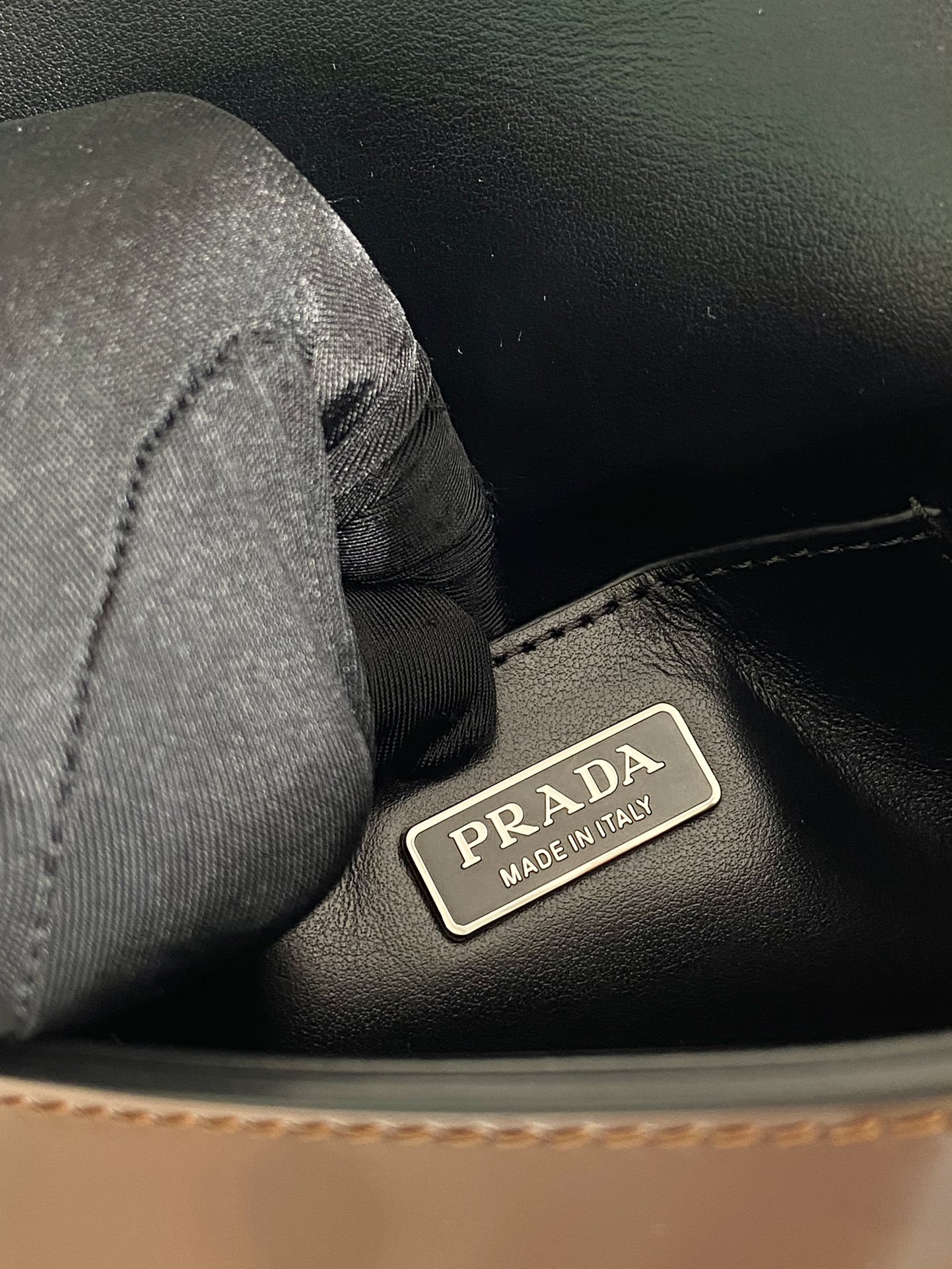 Pra*a brushed leather mini-bag with shoulder strap