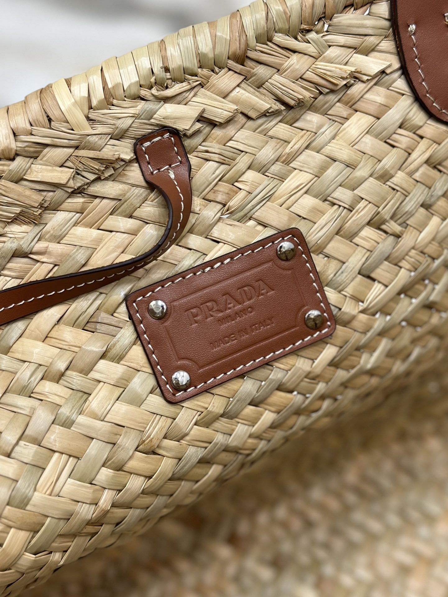 Pra*a woven palm and leather tote