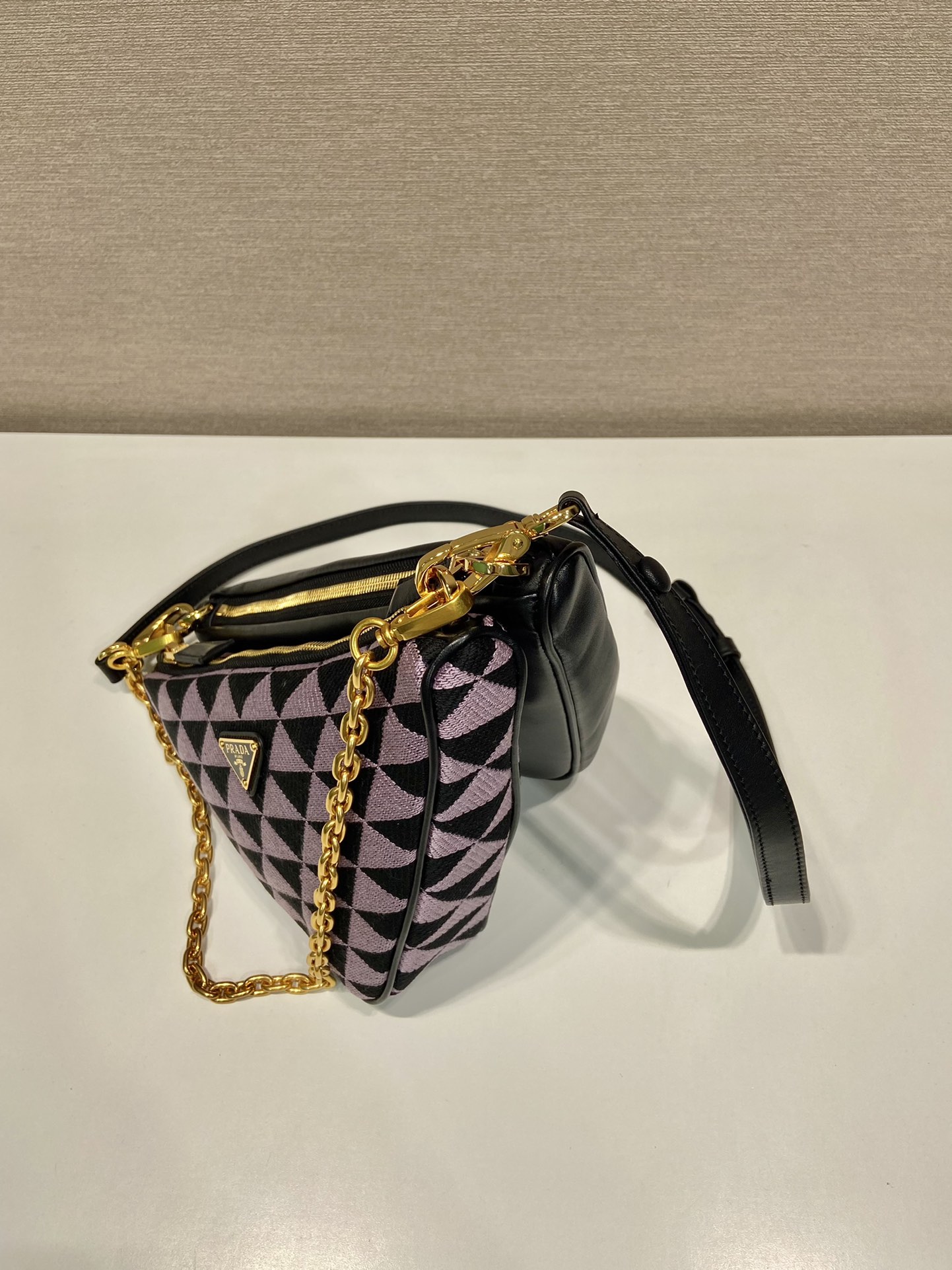 Pra*a symbole leather and fabric mini bag