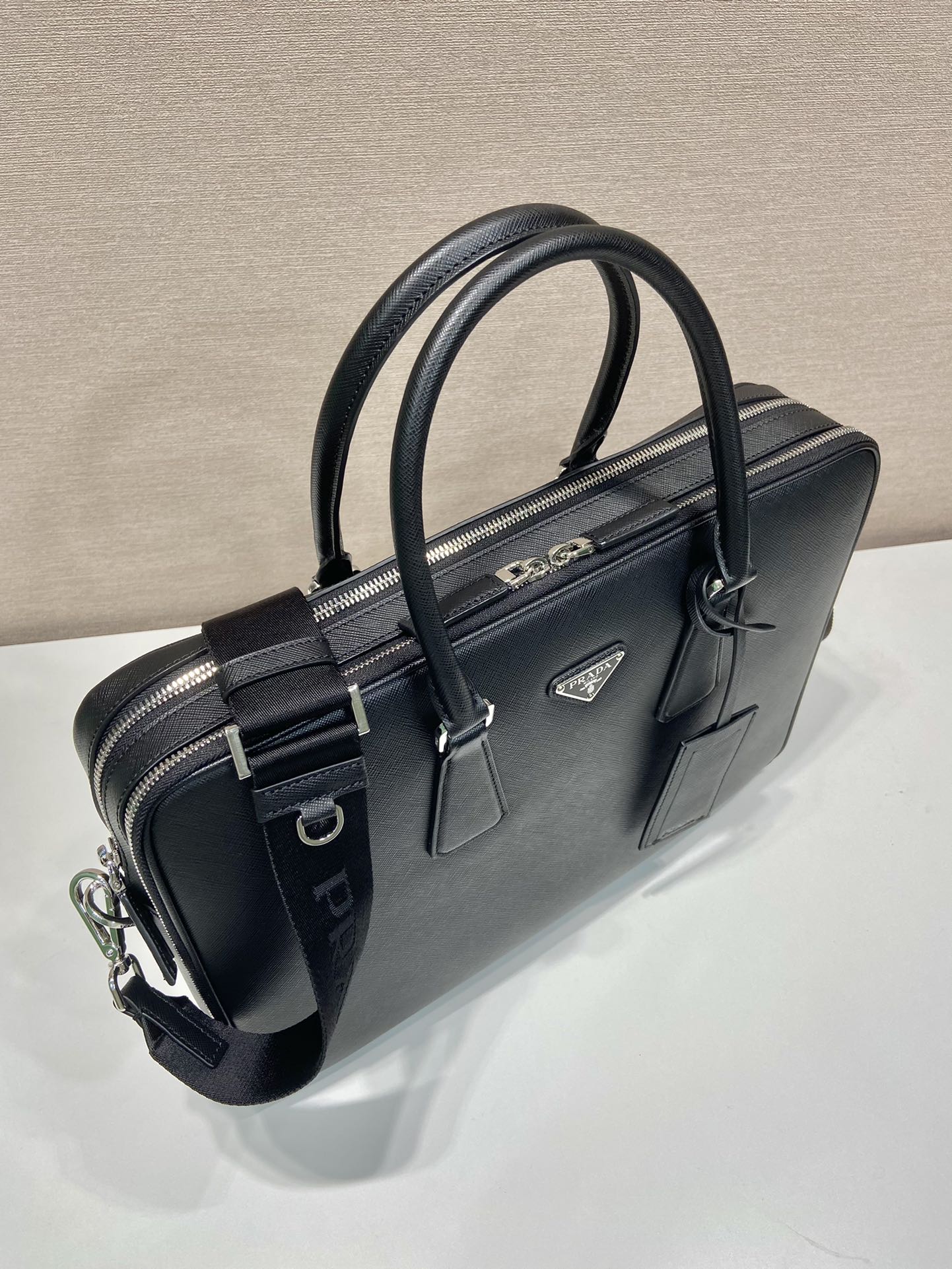 Pra*a saffiano leather briefcase