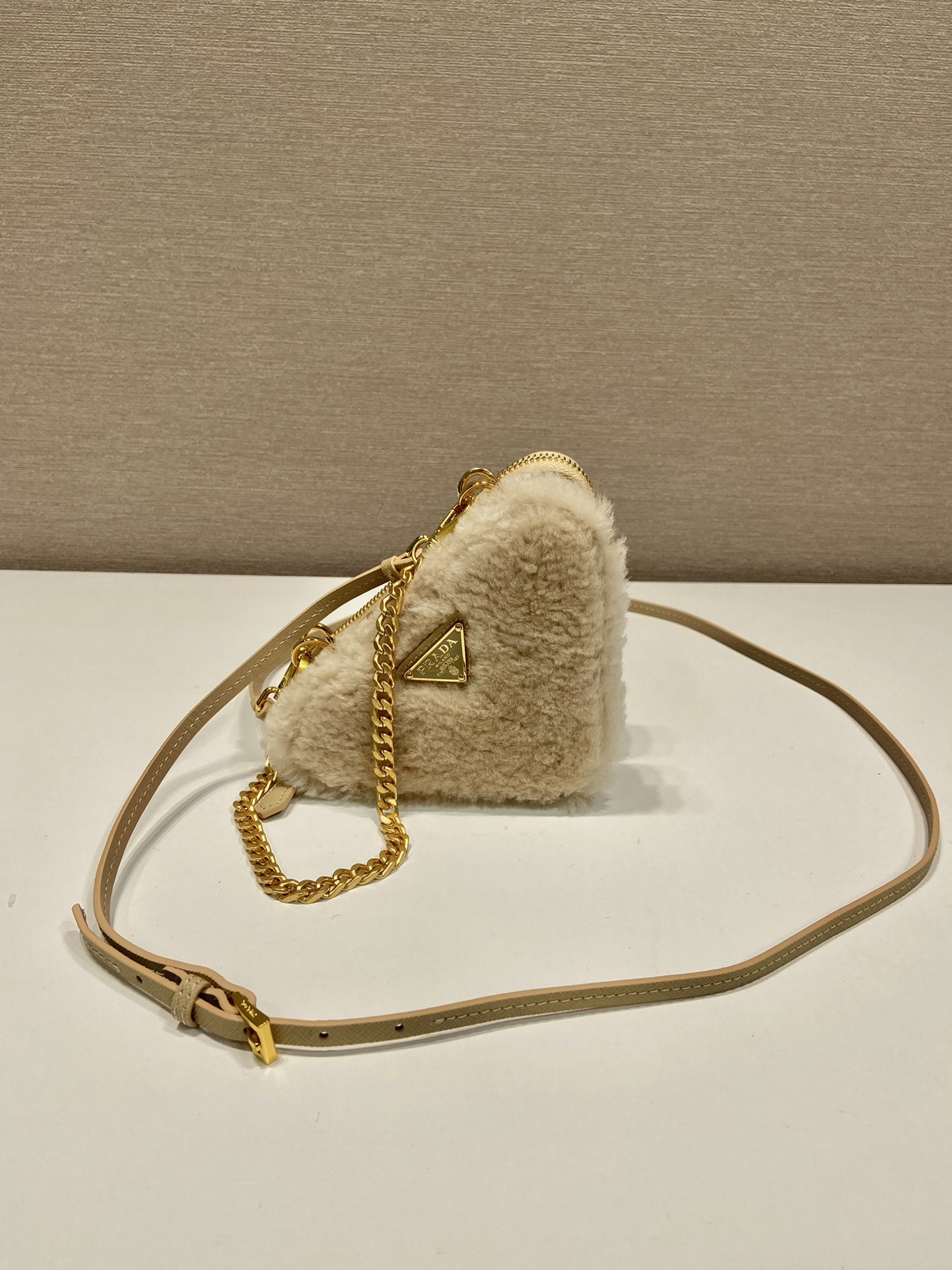 Pra*a shearling and saffiano leather mini-pouch