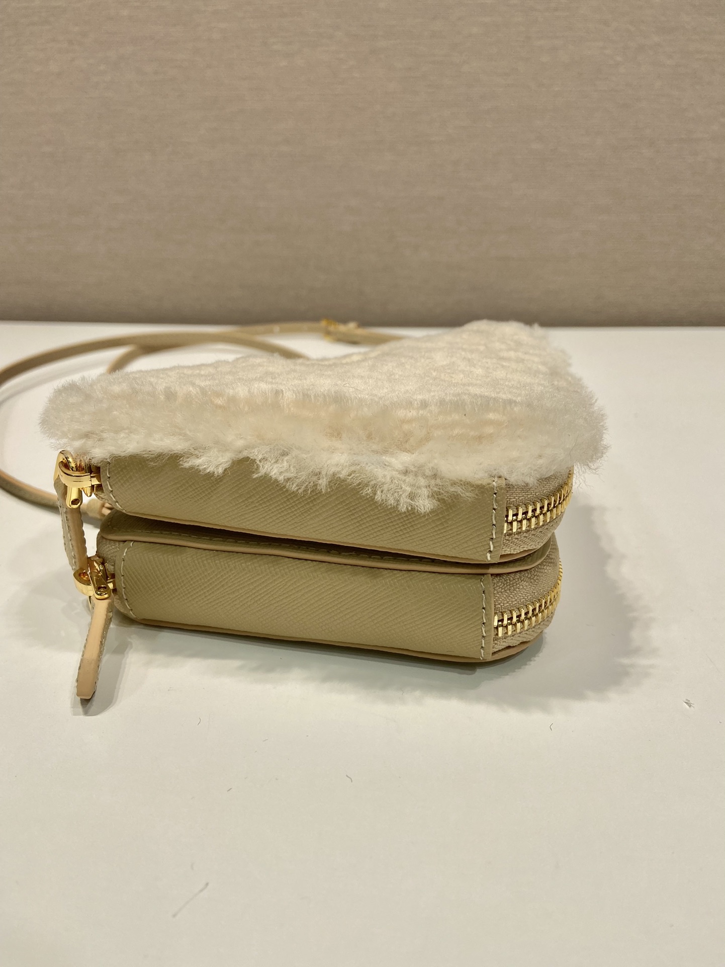 Pra*a shearling and saffiano leather mini-pouch