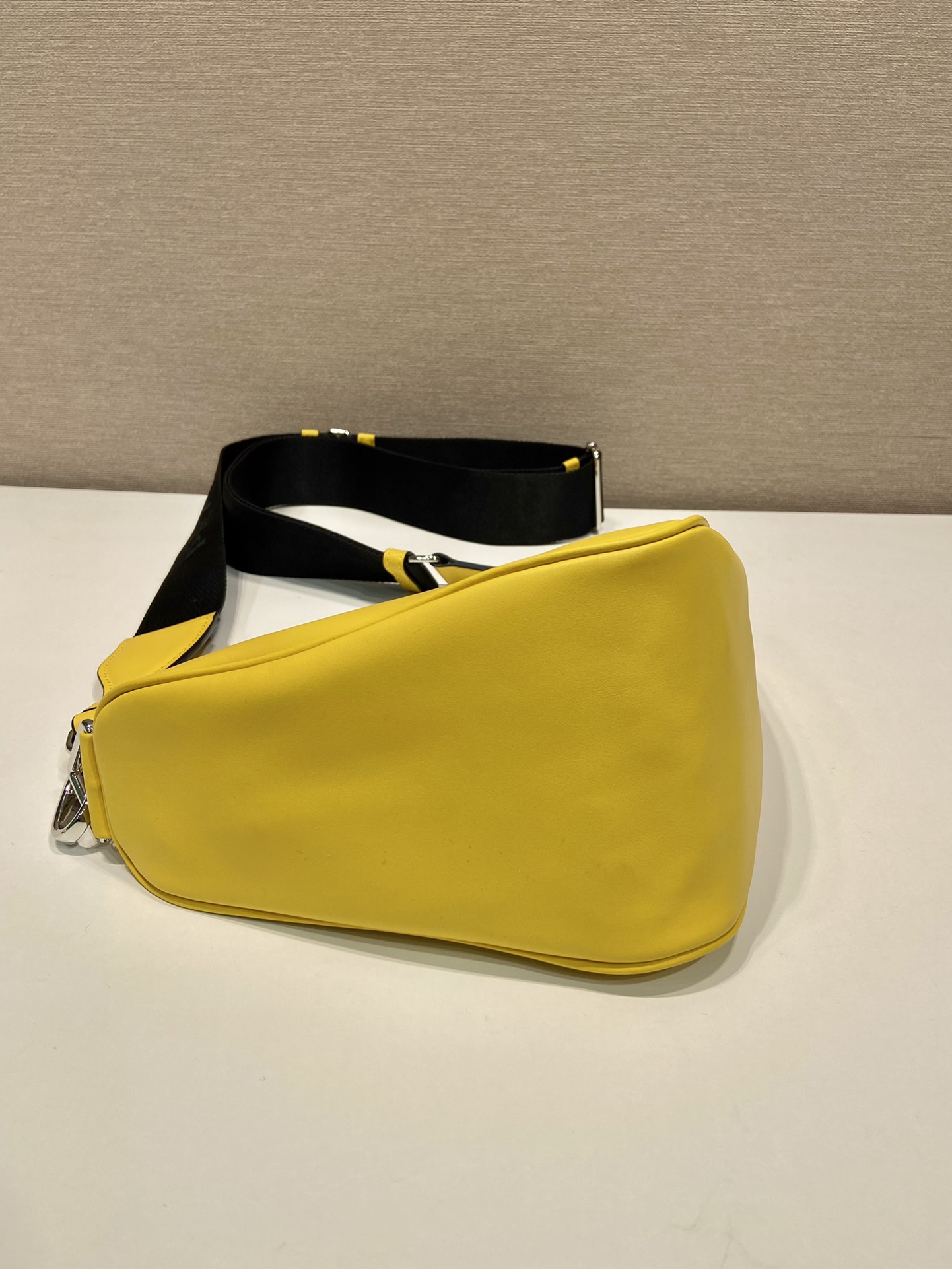 saffiano Pra*a triangle bag