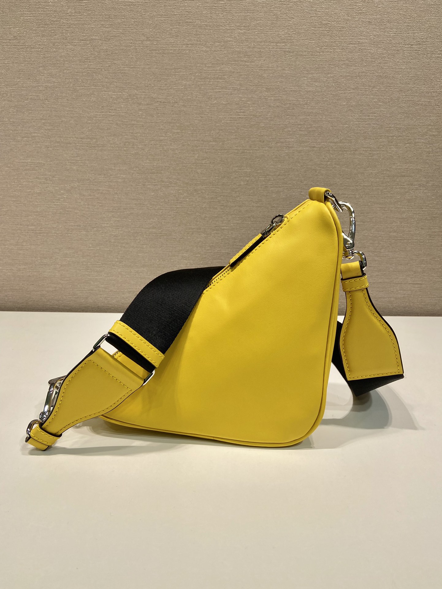 saffiano Pra*a triangle bag