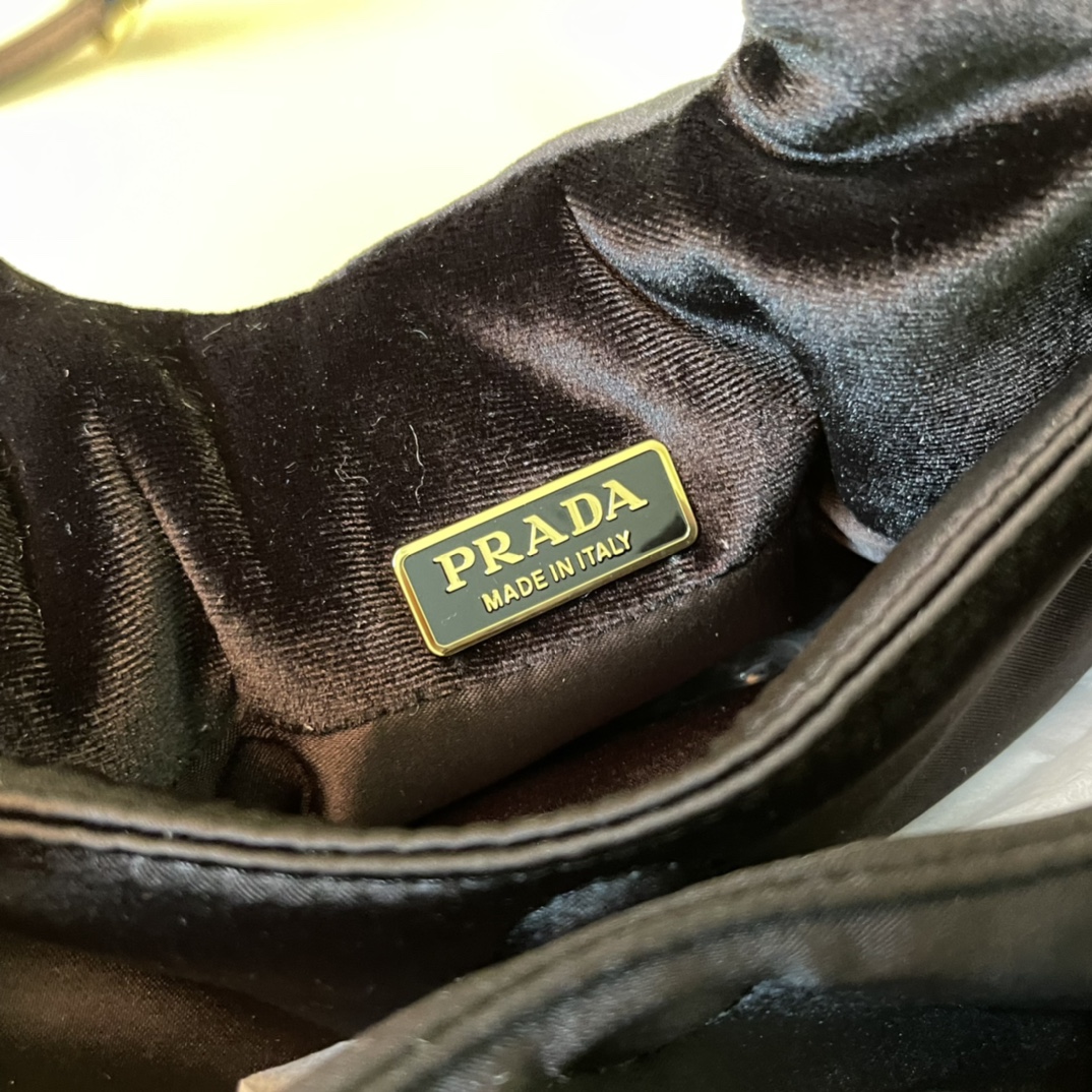 Pra*a padded velvet mini handbag