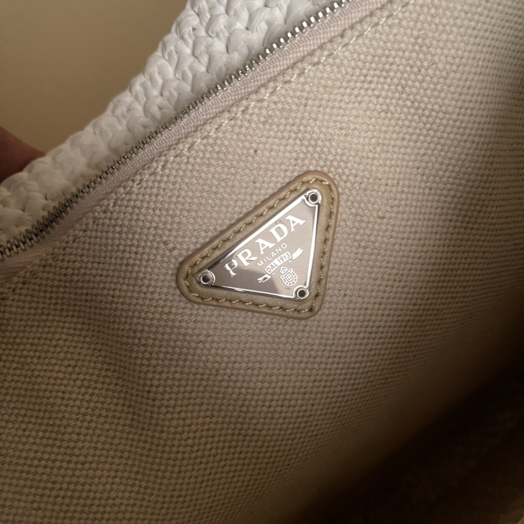 Pra*a crochet and leather mini-bucket bag