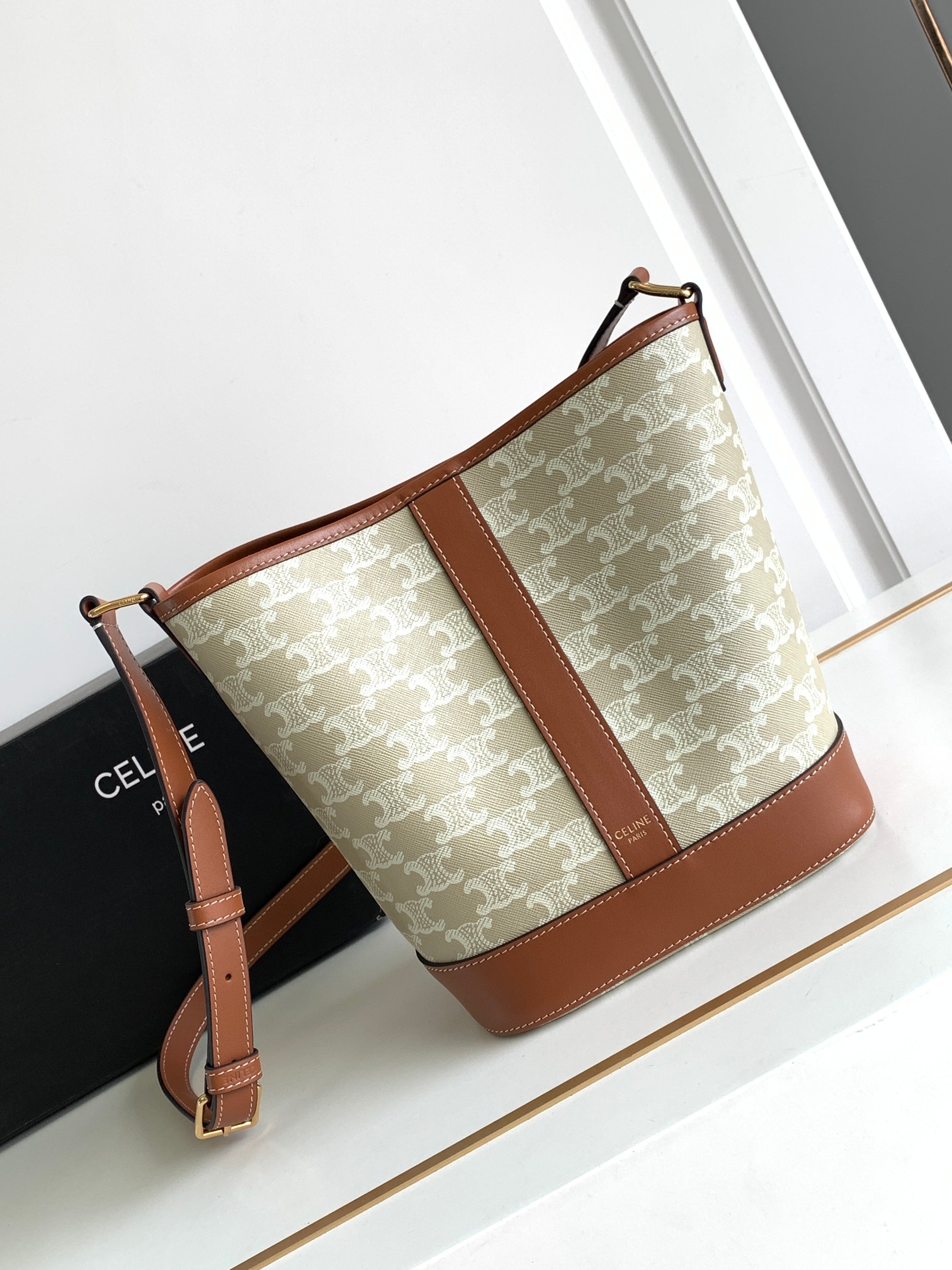 Ce**e small bucket in triomphe canvas and calfskin