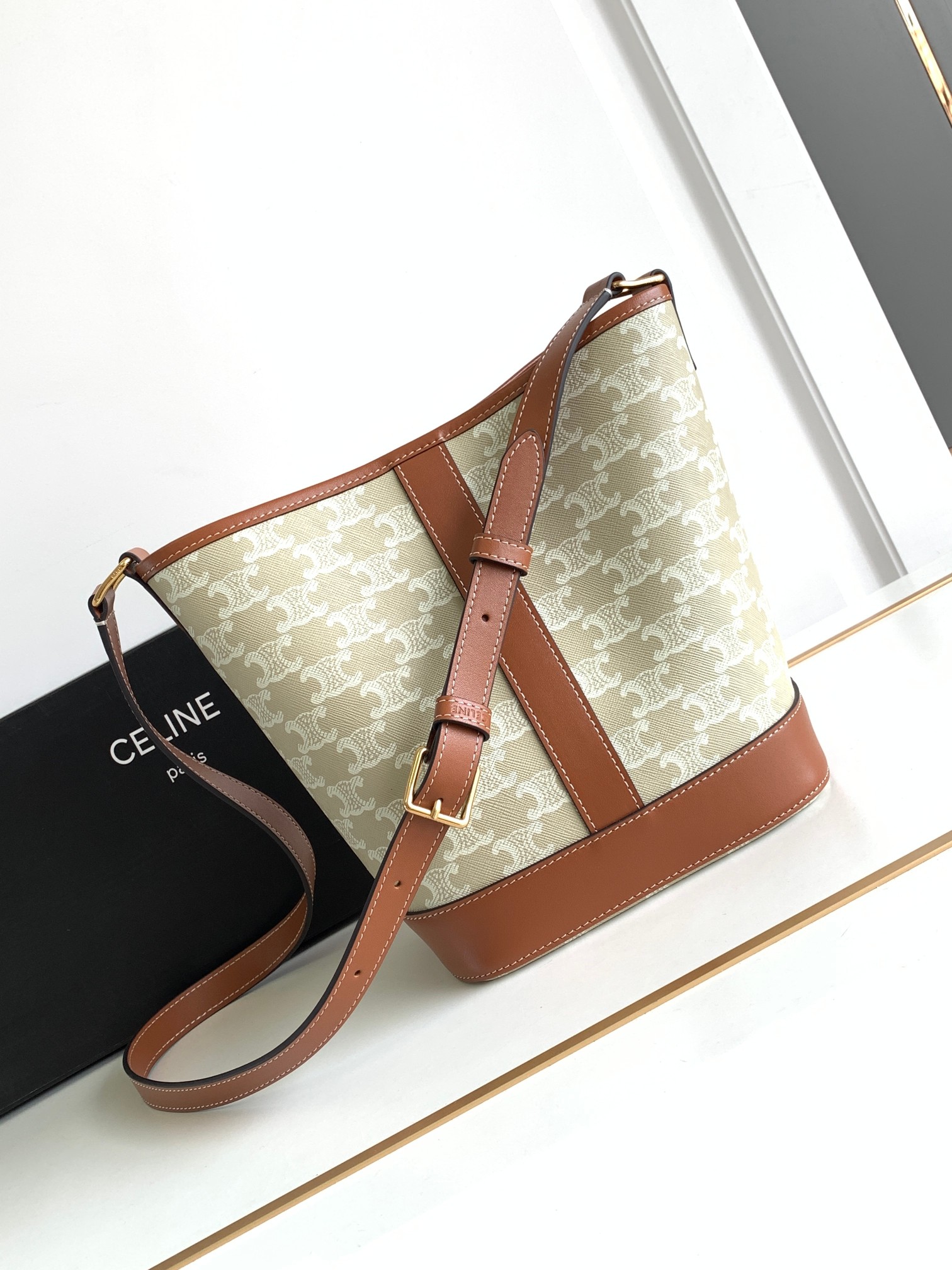Ce**e small bucket in triomphe canvas and calfskin