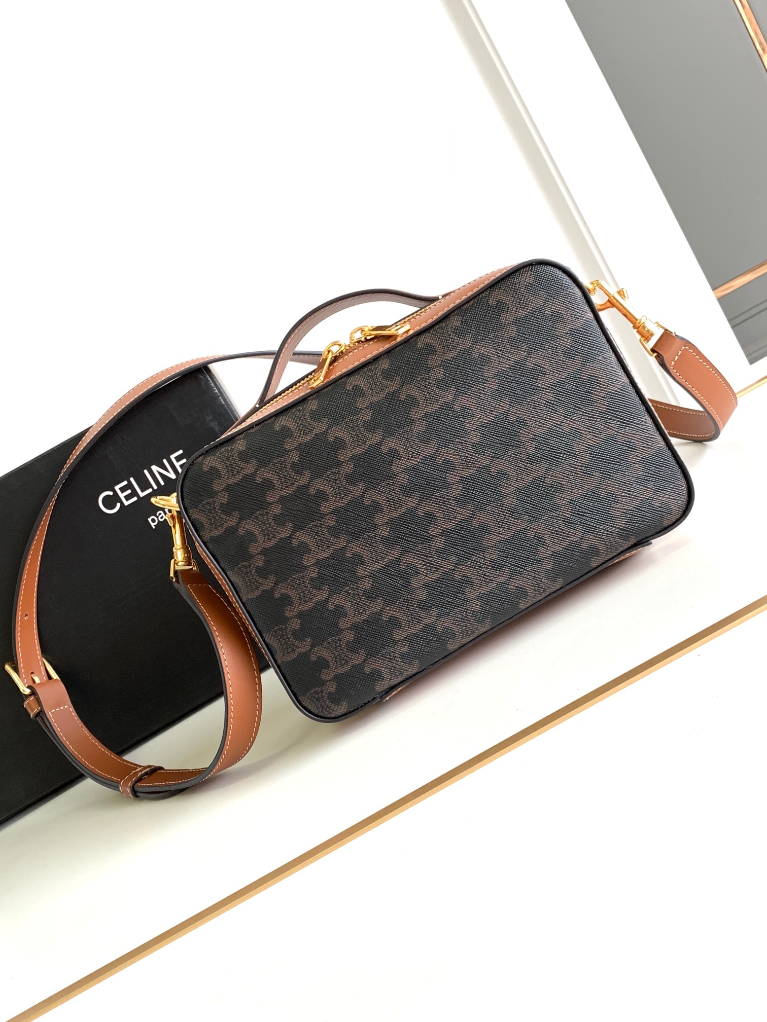 Ce**e messenger box in triomphe canvas and calfskin