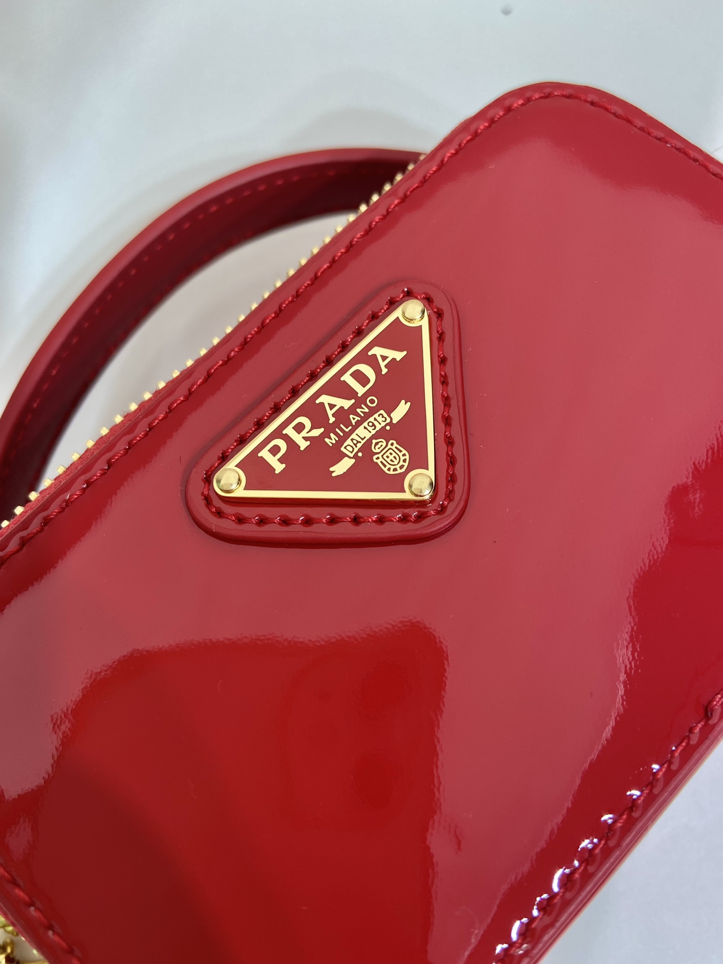 Pra*a patent leather mini-pouch