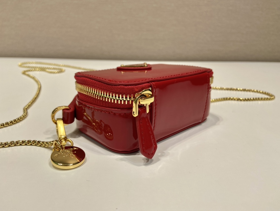 Pra*a patent leather mini-pouch