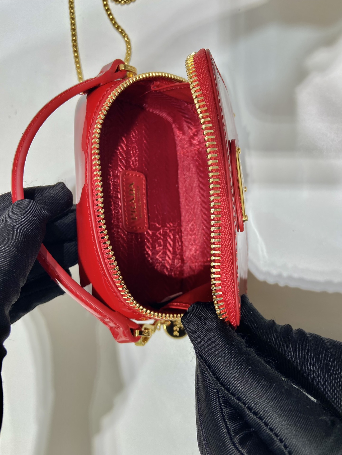 Pra*a patent leather mini-pouch