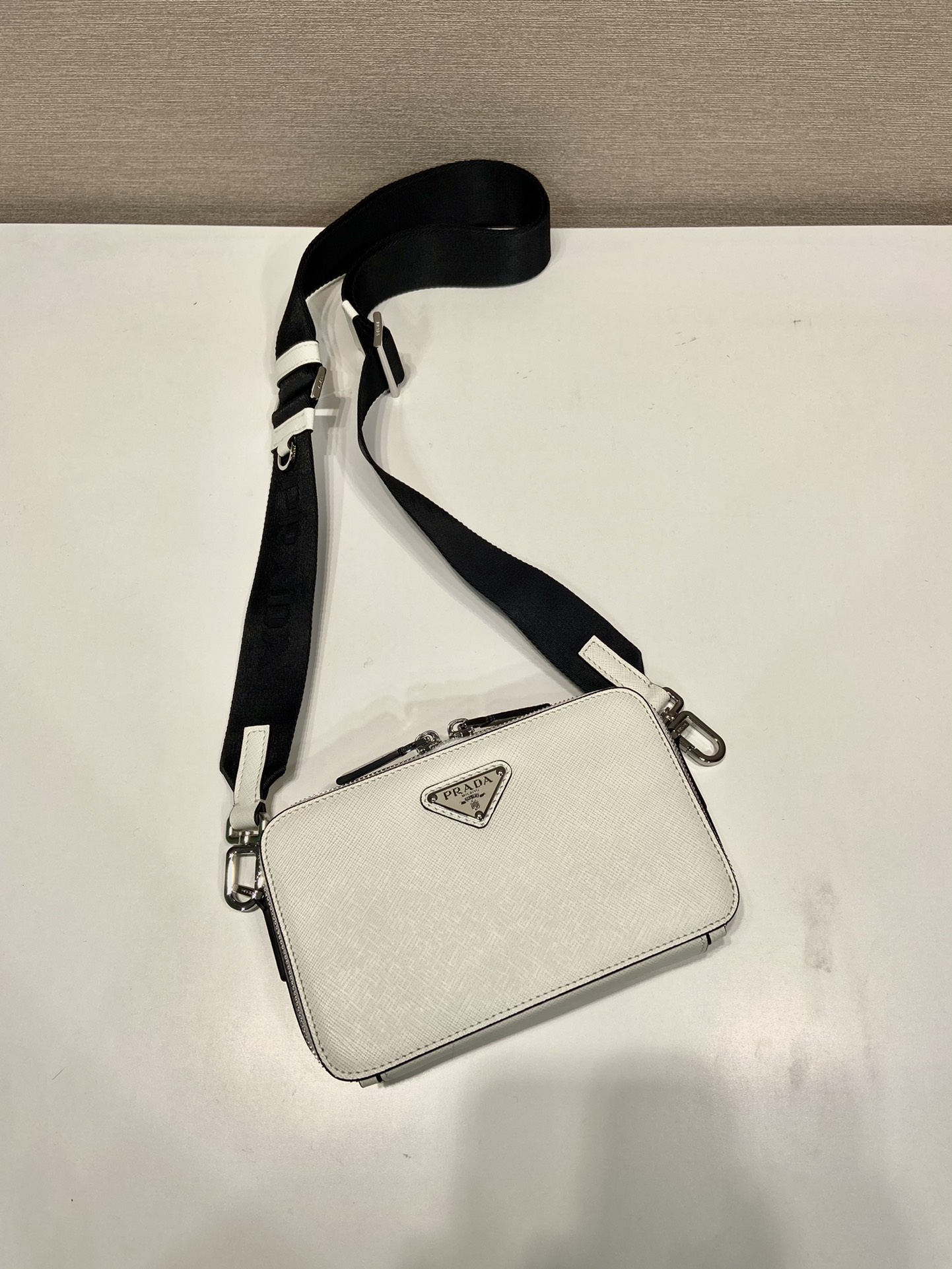 Pra*a brique saffiano leather bag