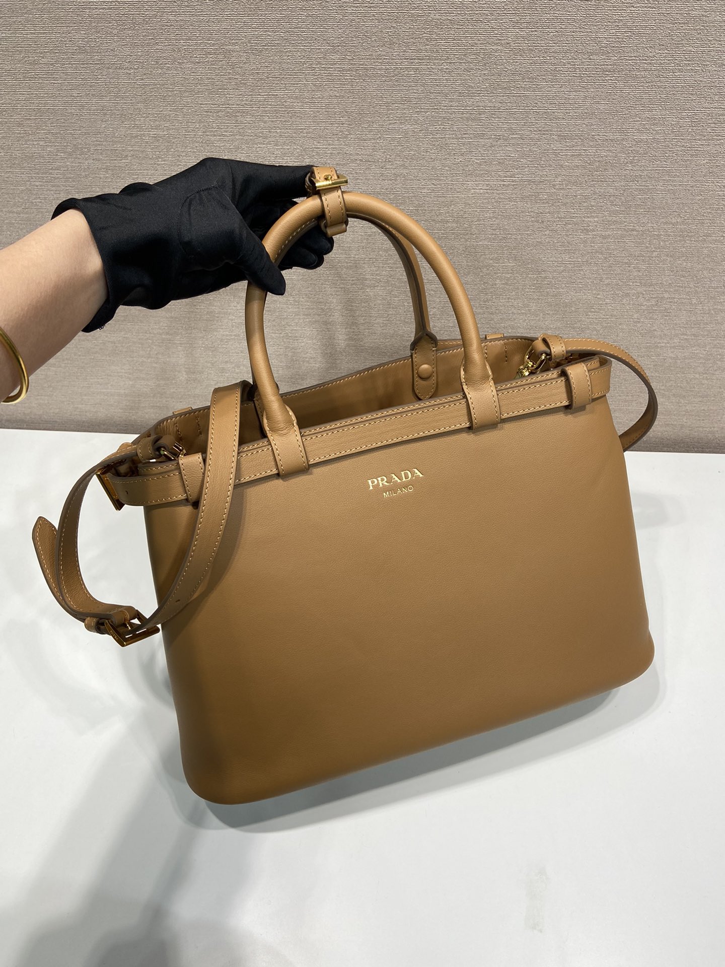 Pra*a buckle medium leather handbag with double belt