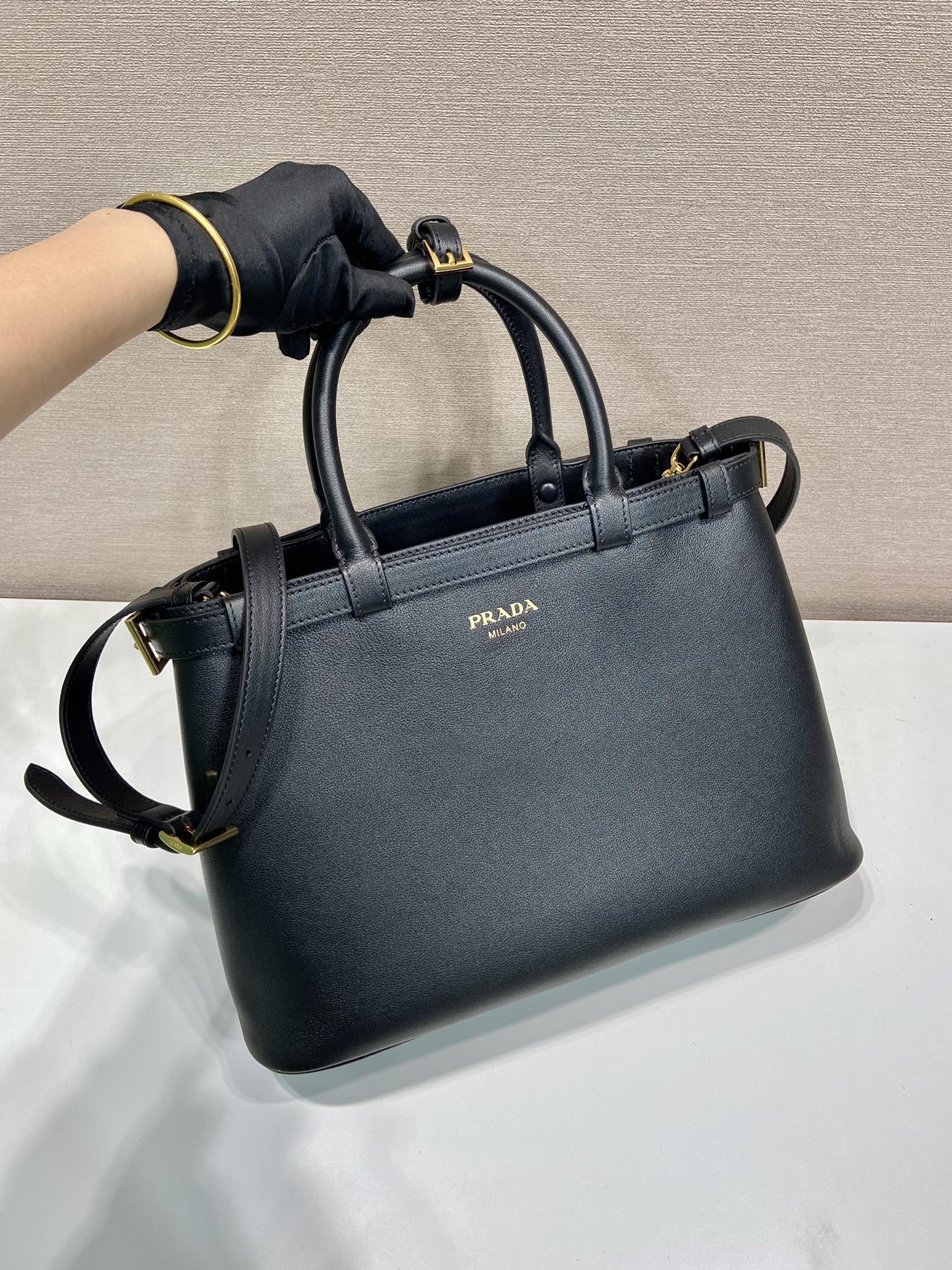 Pra*a buckle medium leather handbag with double belt