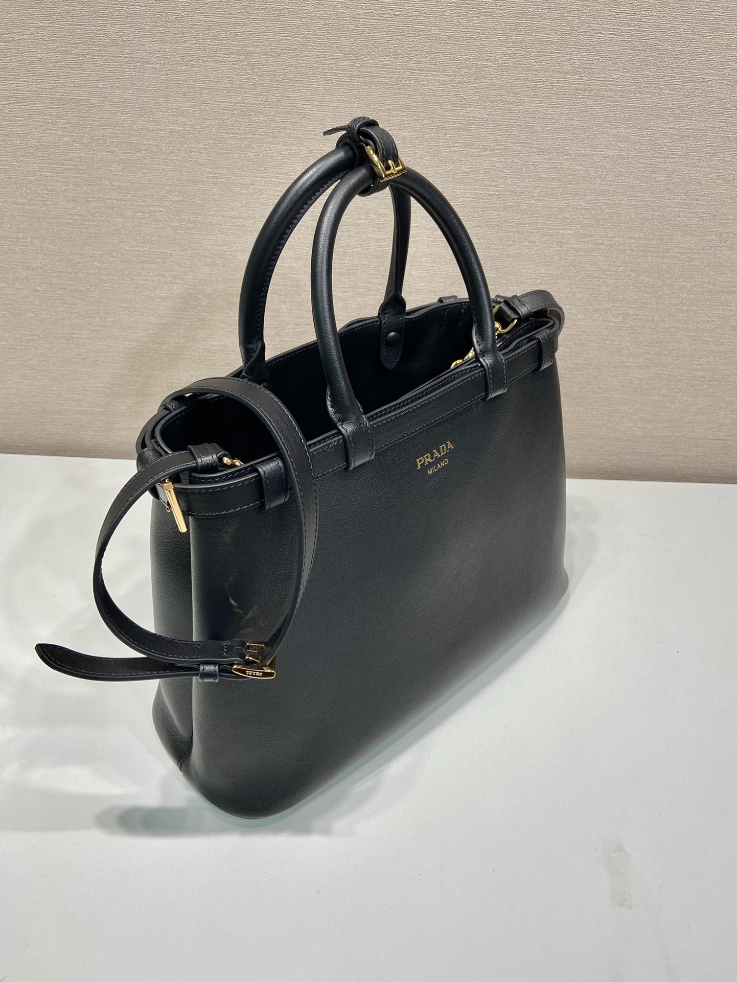 Pra*a buckle medium leather handbag with double belt