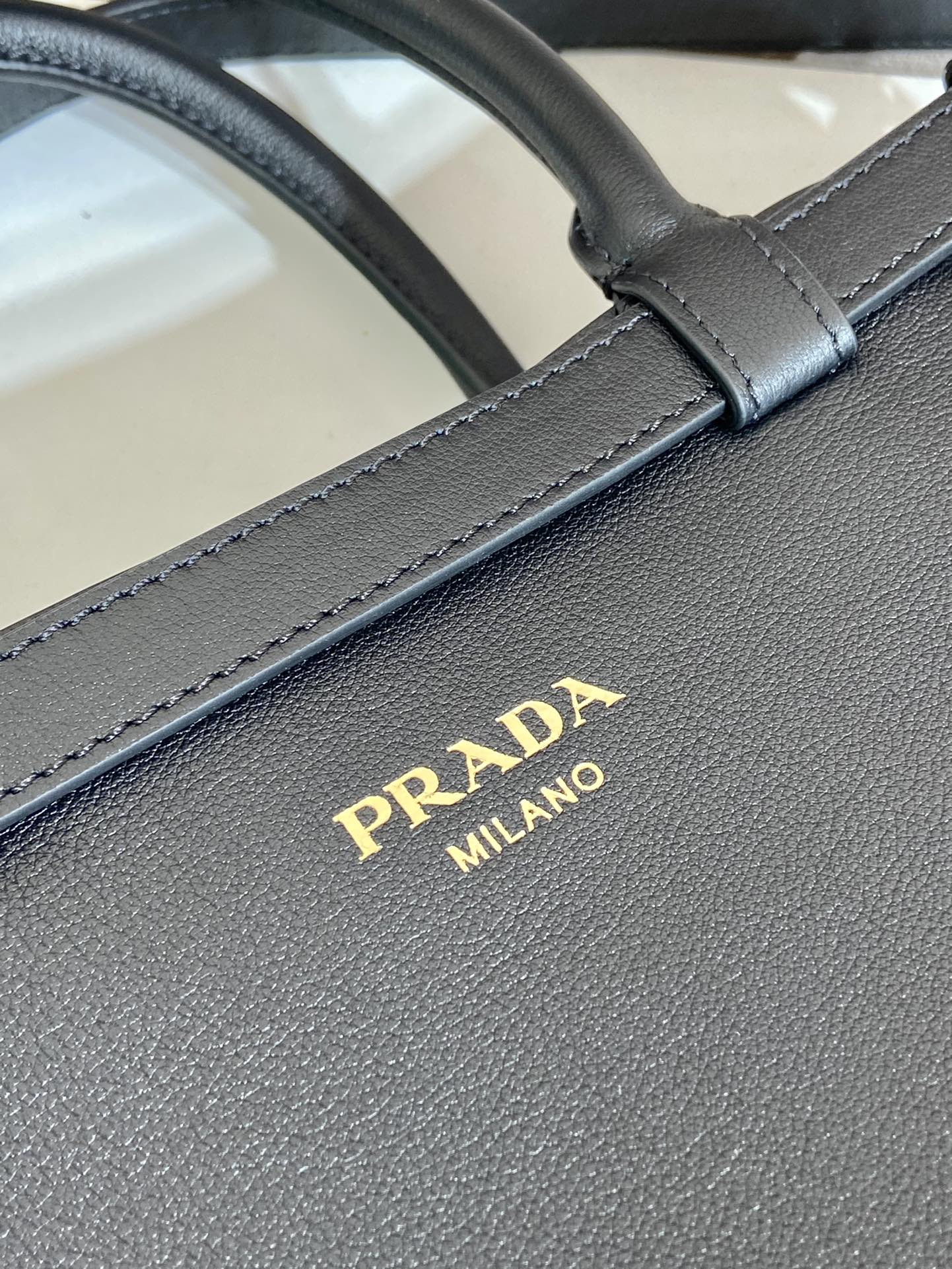 Pra*a buckle medium leather handbag with double belt