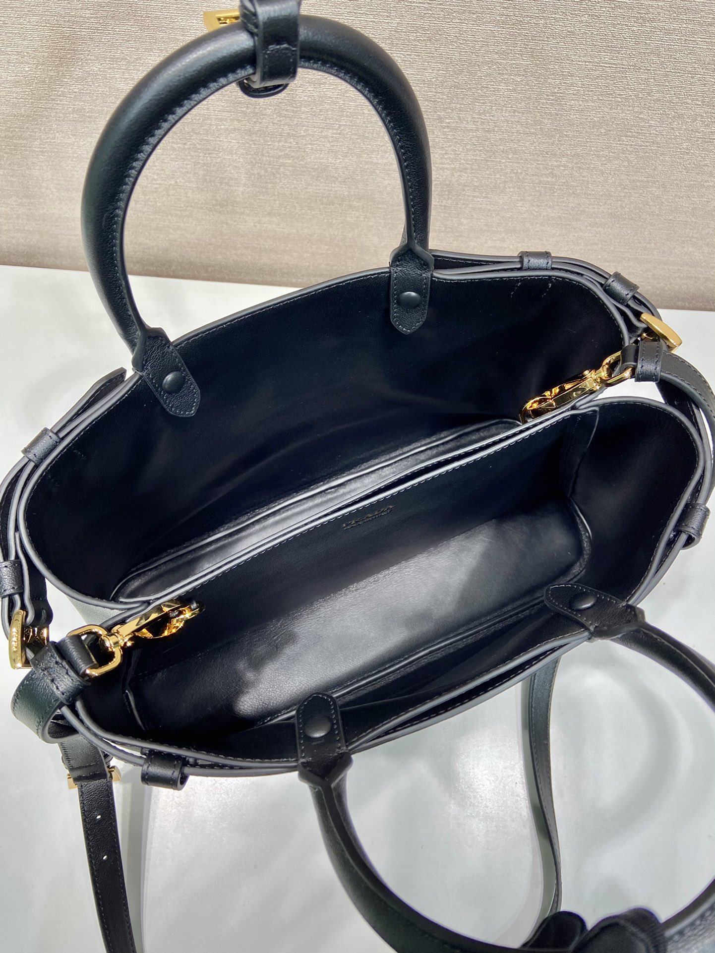 Pra*a buckle medium leather handbag with double belt