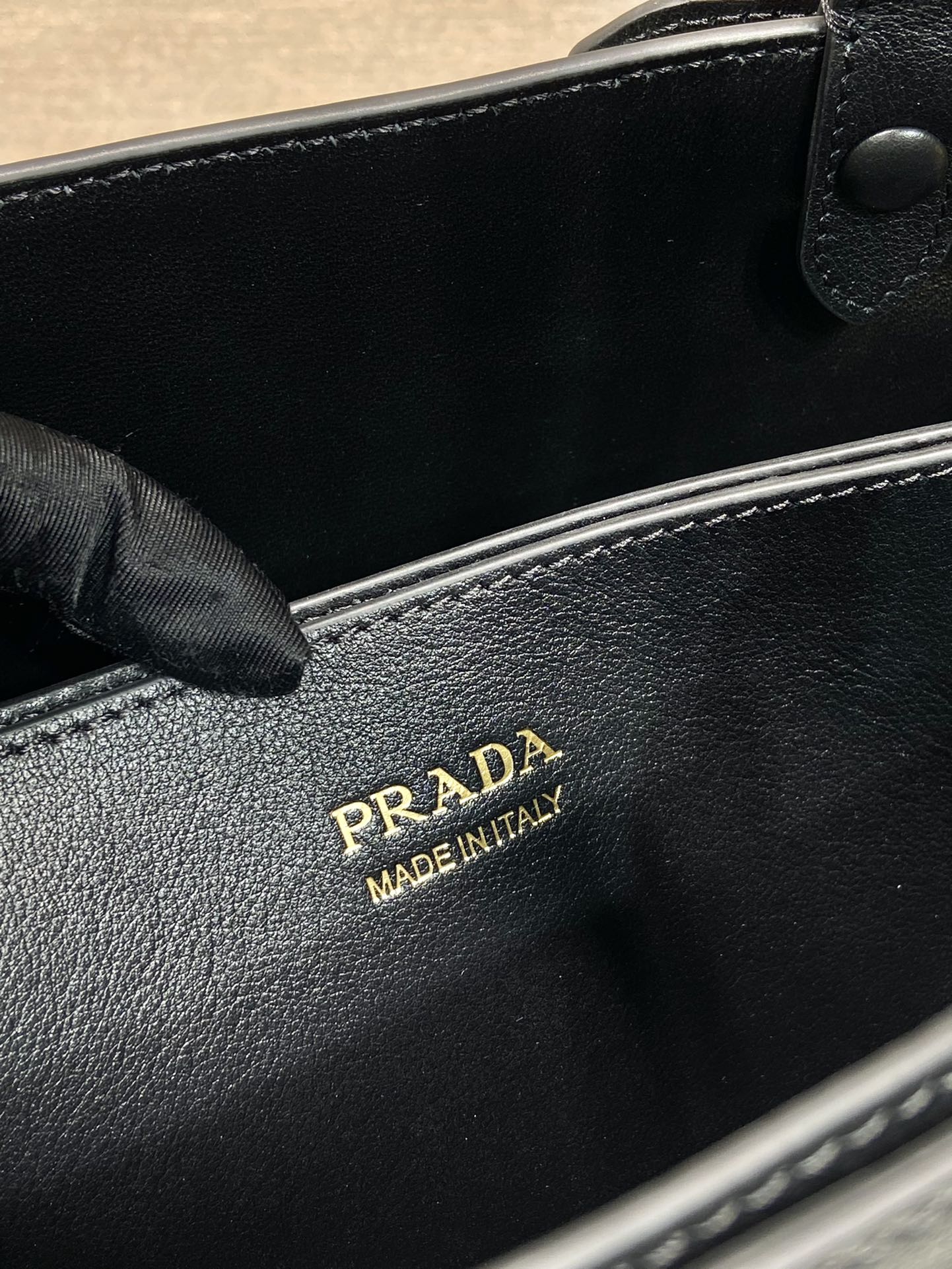 Pra*a buckle medium leather handbag with double belt