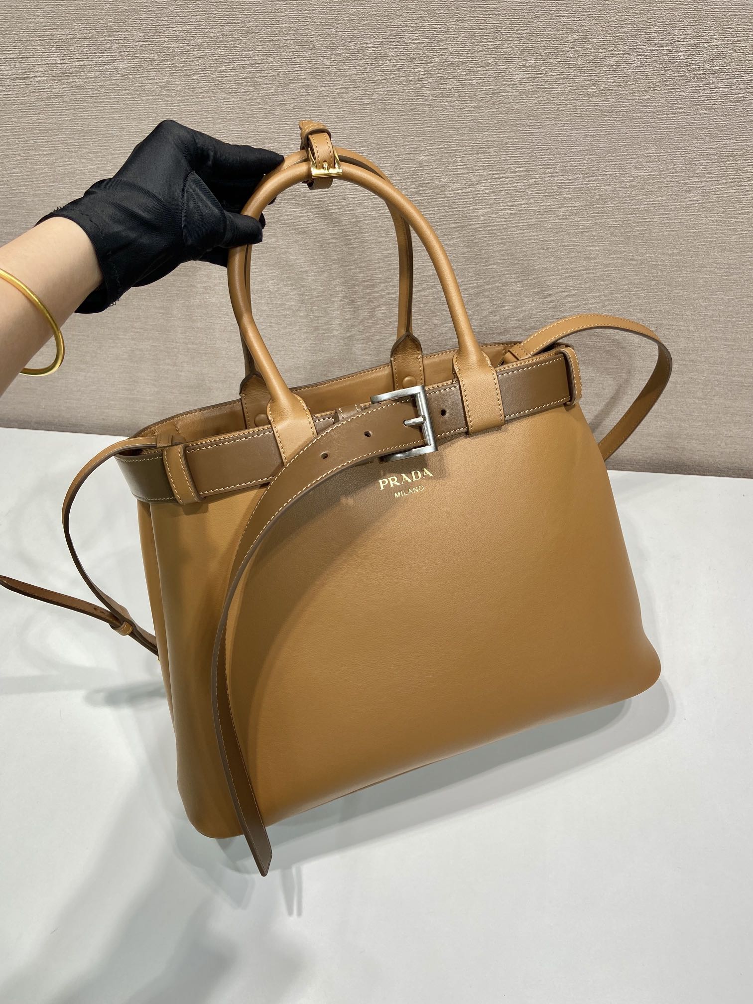 Pra*a buckle large leather handbag with belt
